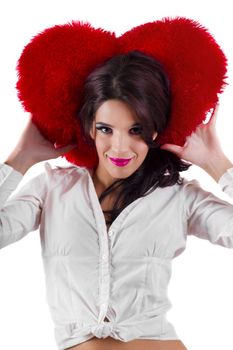 View of a beautiful girl with a red heart in a white background.