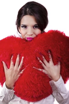 View of a beautiful girl with a red heart in a white background.