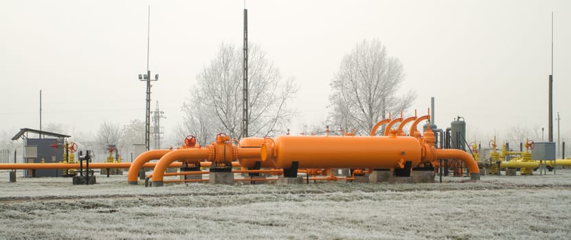 orange gas pipe in frosted winter