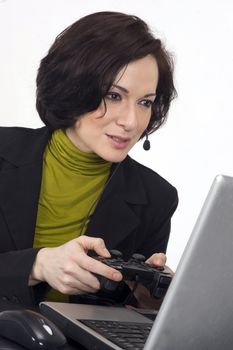 Female holding a game controller playing on her laptoop