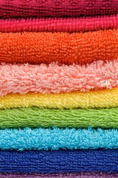 Background of Stacked Rainbow Colored Towels closeup