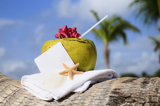 Coconut cocktail starfish tropical Caribbean beach refreshment and towel