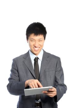 Smiling Asian young businessman using a PC tablet, portrait