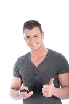 Smiling man with his smartphone showing thumb up isolated on white