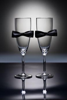 Champagne glasses with conceptual same sex decoration for gay men