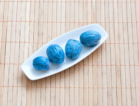 dish of nuts on a bamboo napkin