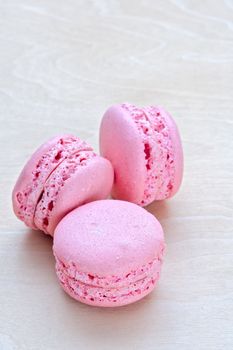 pink macaron on wooden background