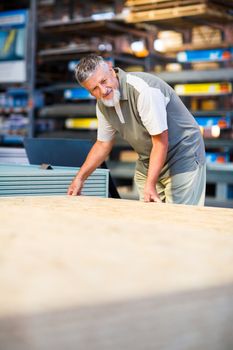 Man buying construction wood in a  DIY store