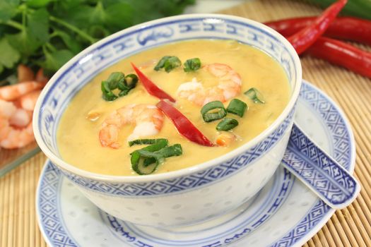 Curry soup with colorful vegetables and prawns