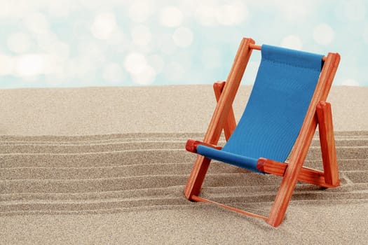 Vacation background with lounger in beach sand