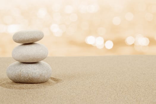 Balance zen stones in sand on white background