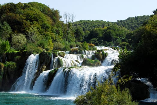 Waterfalls in Croatian forest park in summer day
