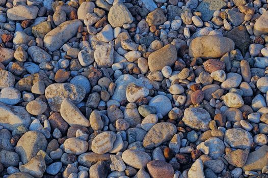 Sea beach. Natural small pebbles on the seashore
