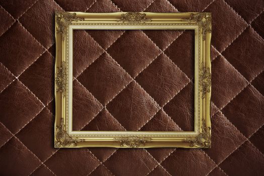 golden frame on red leather