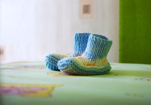 woolen knitted bootees for a newborn baby