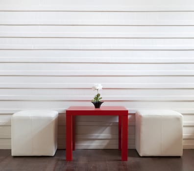 red table and white stools