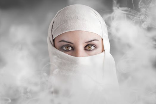 Arabic woman into smoke clouds