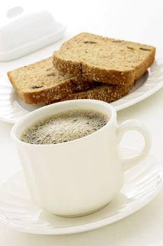 delicious breakfast with fresh hot coffee, butter and whole grain bread.