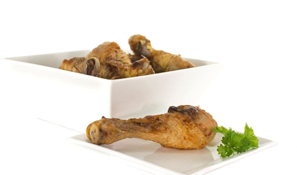 chicken and green parsley food on white dish