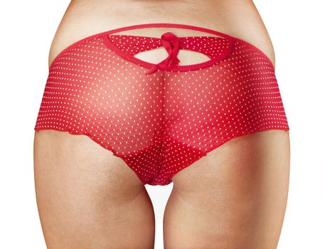 closeup of beautiful woman buttocks in red shorts with path