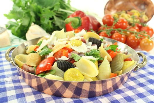 a noodle dish with vegetables and ham strips