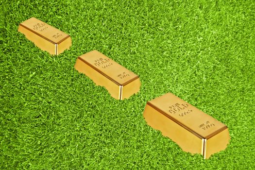 Gold bars in green grass