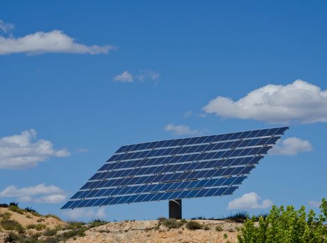 Large photovoltaic solar panel against blue sky