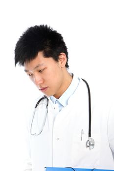 Thoughtful Asian young male doctor wearing a stethoscope and looking down