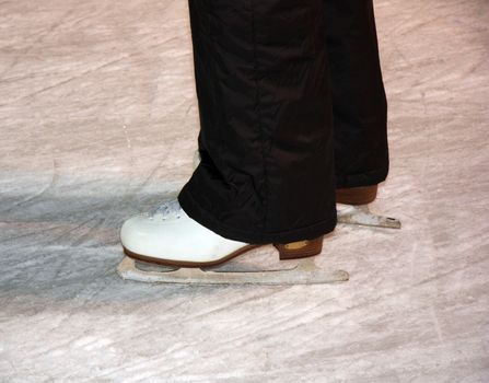 Pair of ice skates standing on the rink