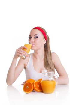 Sporty woman drinking orange juice and fruits, isolated health concept