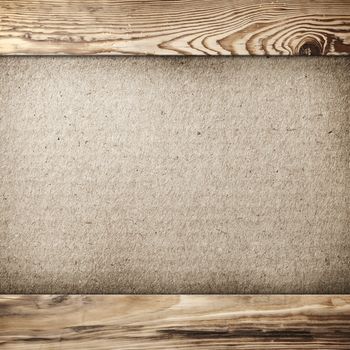 Grunge cardboard background in wood frame with copy space