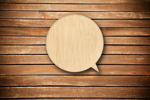 Retro speech bubble from wood on wood background