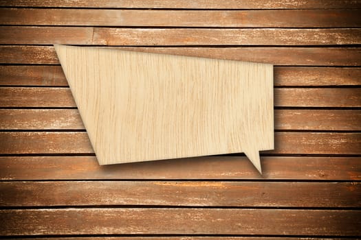 Retro speech bubble from wood on wood background