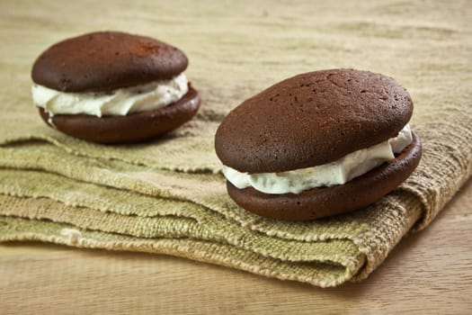 close up of Chocolate cream Cookie on wooden table