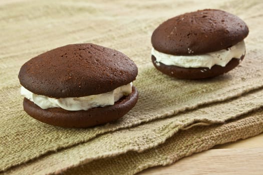 close up of Chocolate cream Cookie on wooden table