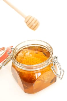 healthy organic honey in a jar isolated on white background