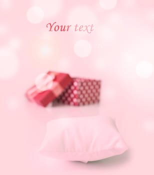 red gift box with hearts and small pillow for your ring on bukeh background