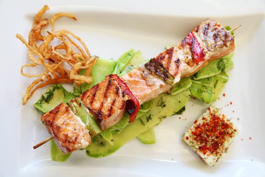 Grilled cube salmon on a plate