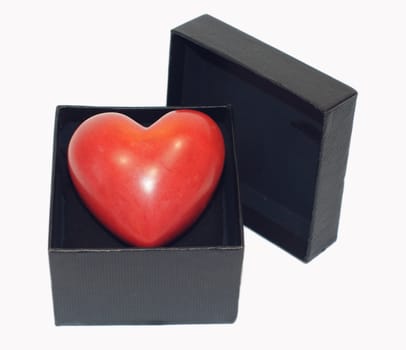 A heart inside a black gift box