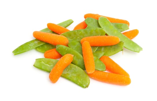 Pile of fresh carrots and snow peas isolated on white background