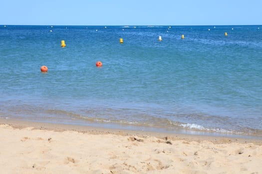 Blue ocean with colorful buoy 