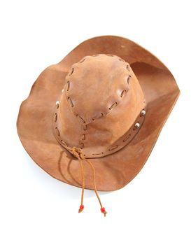 brown western hat on white background 

