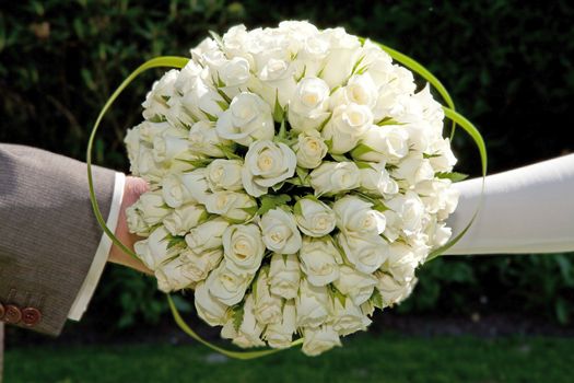 bride and groom holding wedding bouquet