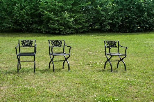 Three chairs arrangement on lawn