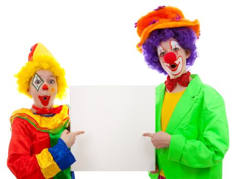 Two girl clowns holding empty text board over white background