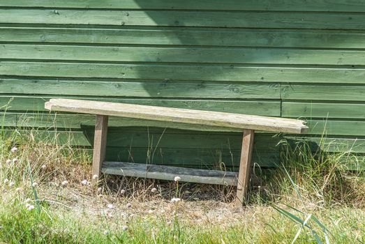 Wooden settee in front of a danish summer residence