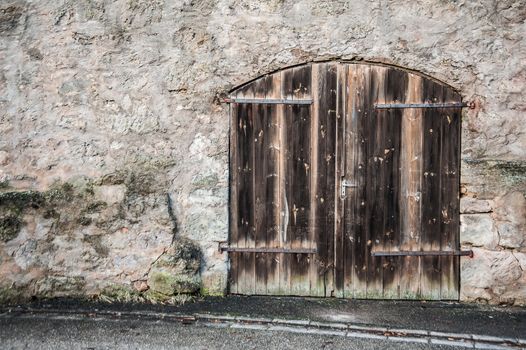 Old wooden door in a historical wall