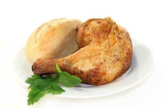 a grilled chicken leg against white background