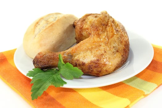 a grilled chicken leg against white background