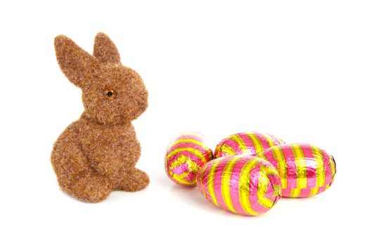bunny and colorful easter eggs over white background
